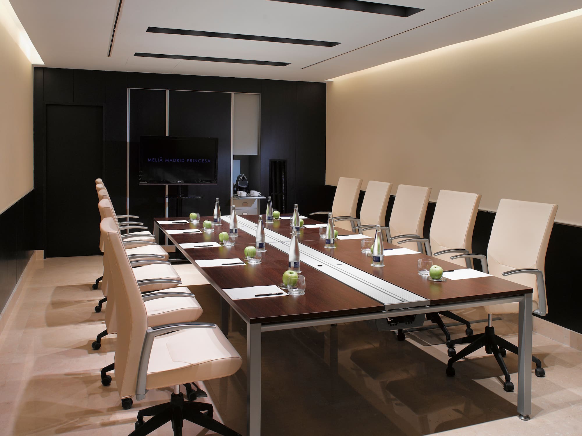 a conference room with a table and chairs
