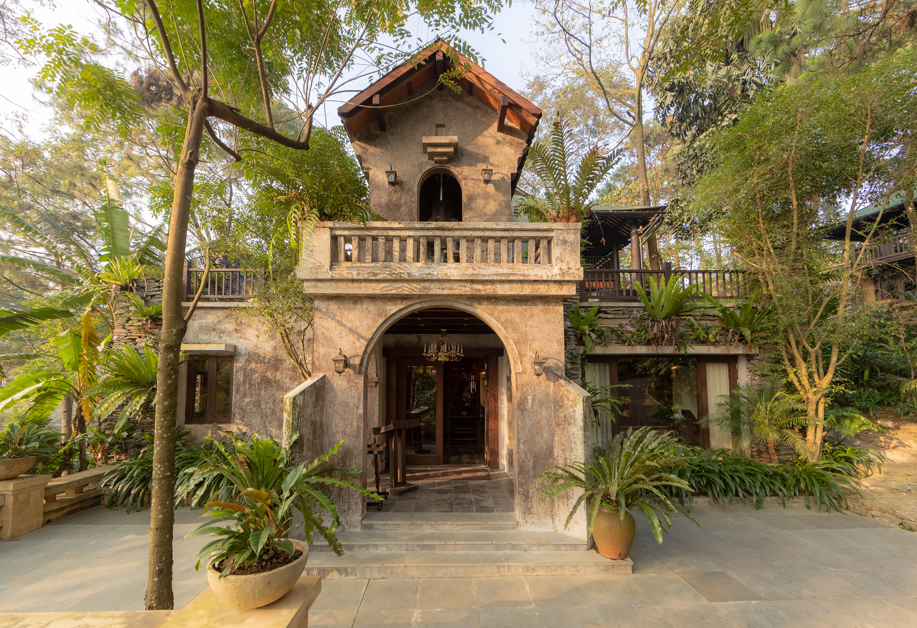 a building with trees and plants around it