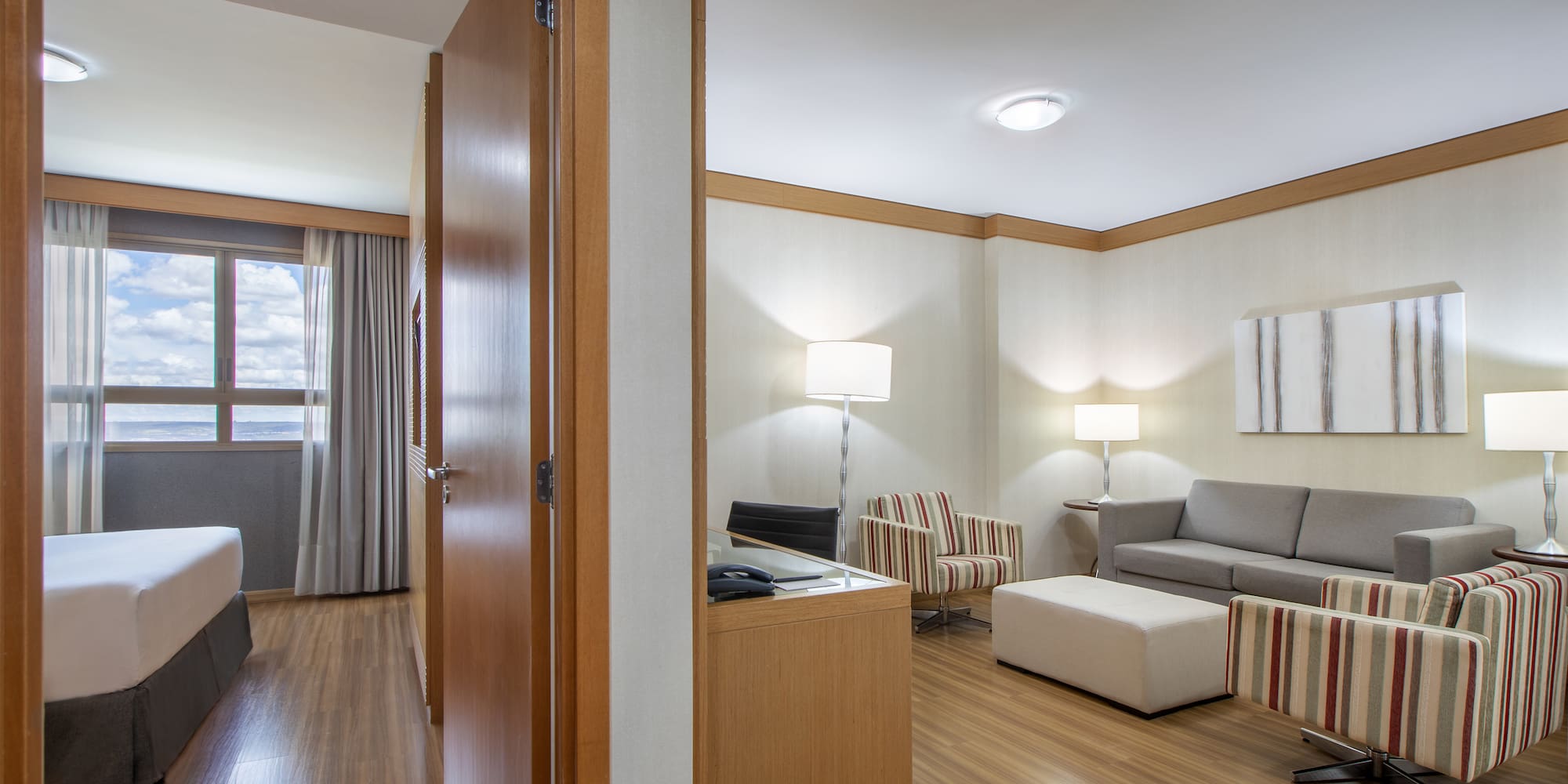 a room with a couch and a couch and a wood floor