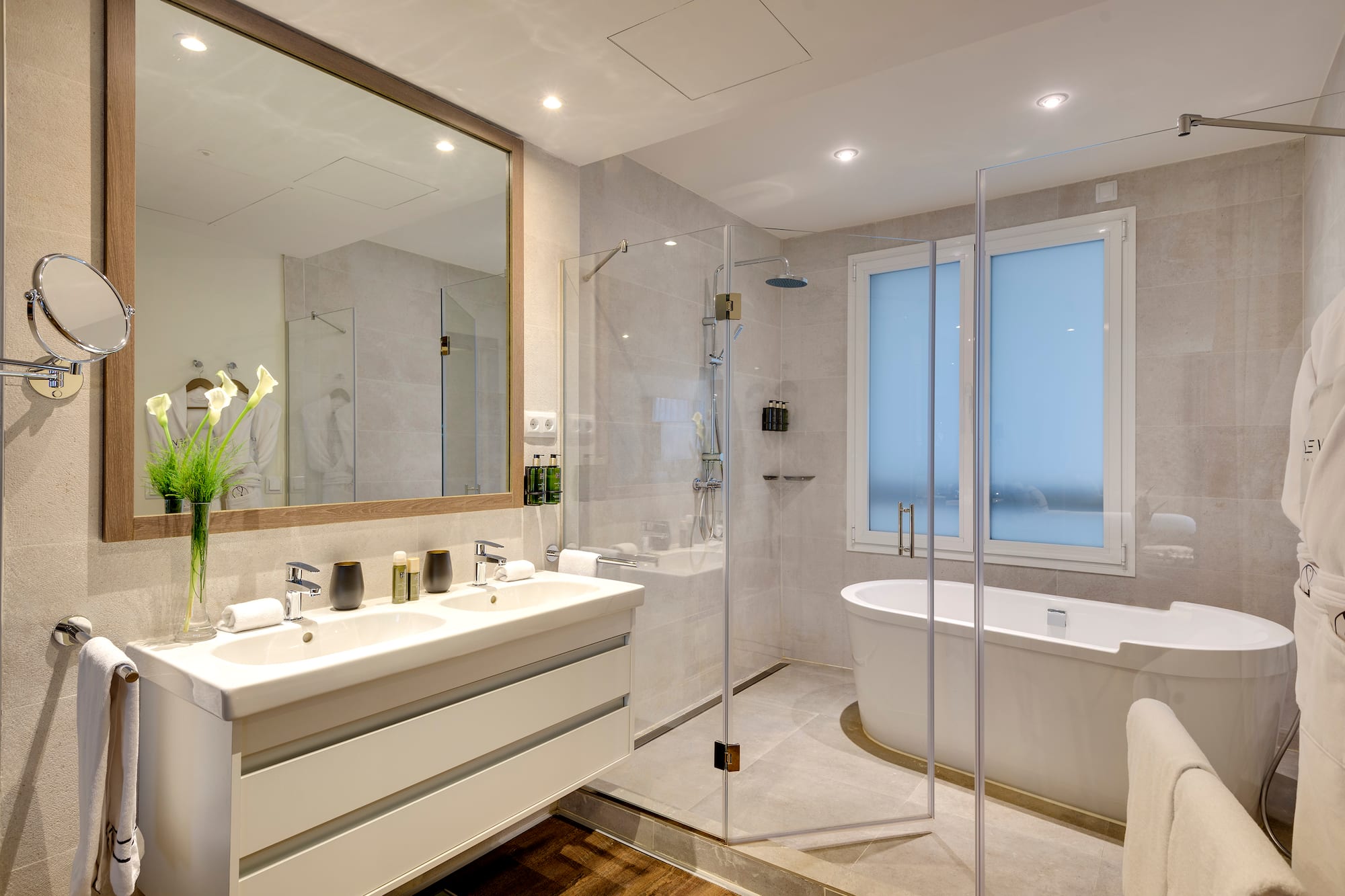 a bathroom with a tub and a shower