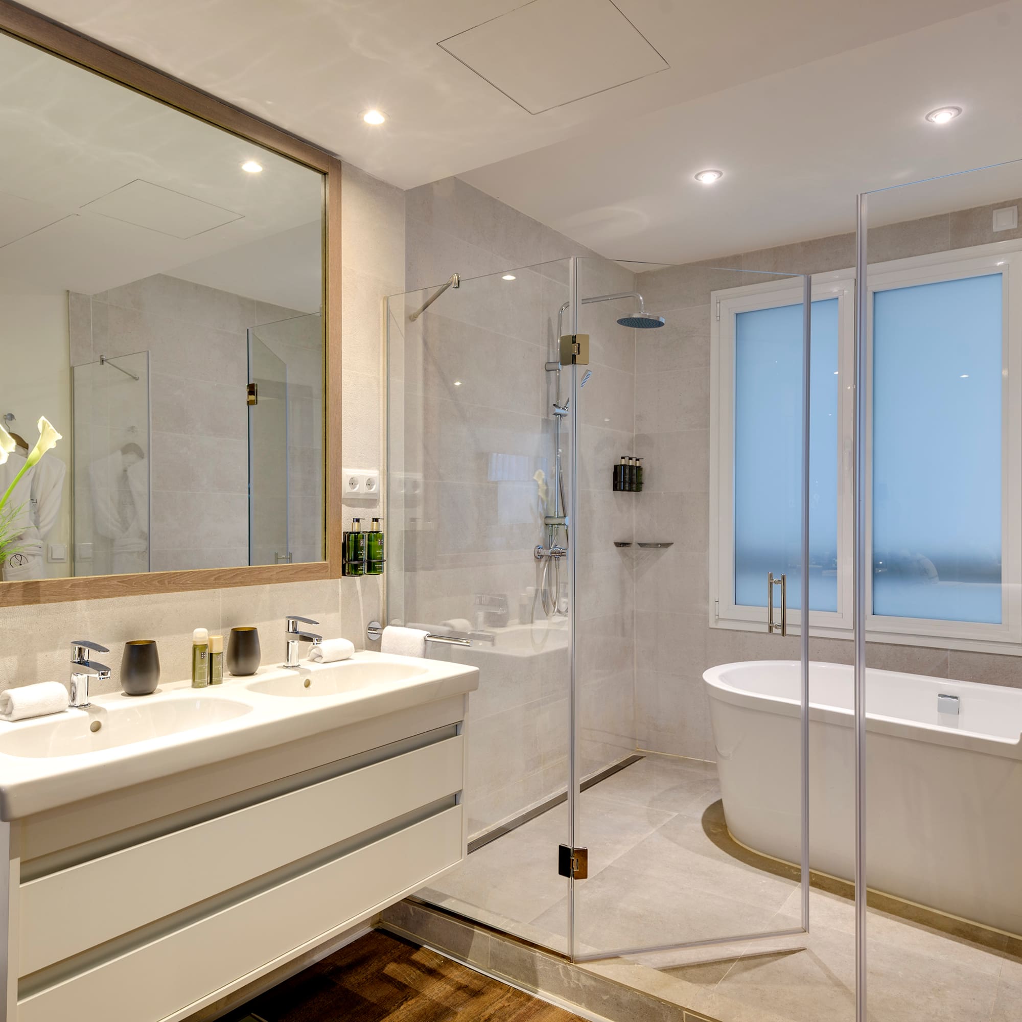 a bathroom with a tub and a shower