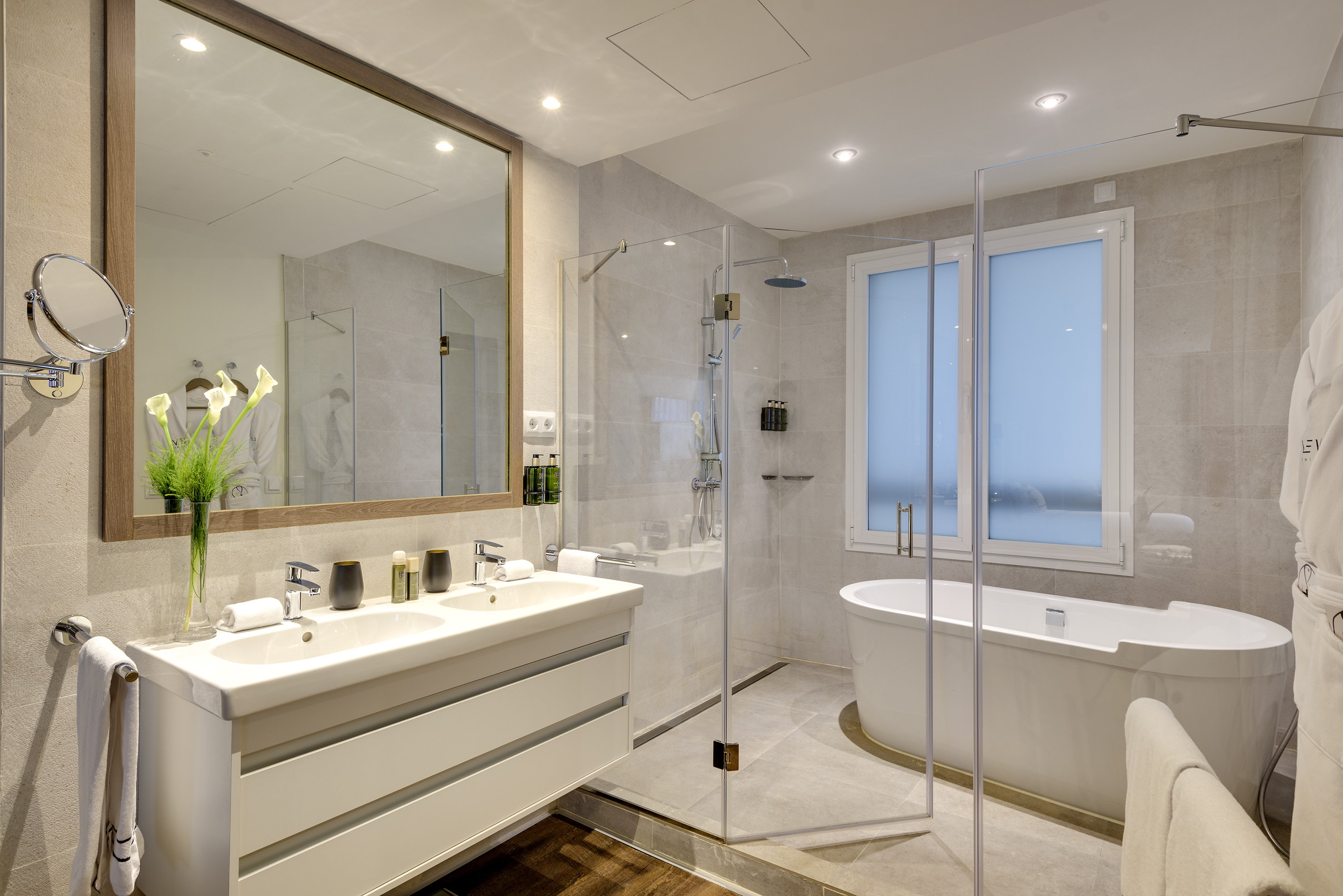 a bathroom with a tub and a shower