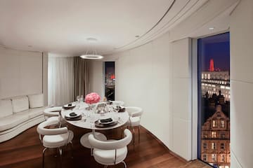 a room with a table and chairs