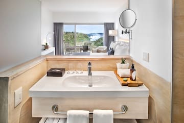 a bathroom with a mirror and a sink