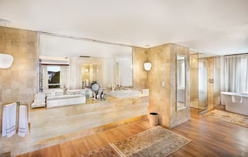 a bathroom with a large sink and a shower