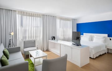 a room with a bed and a tv