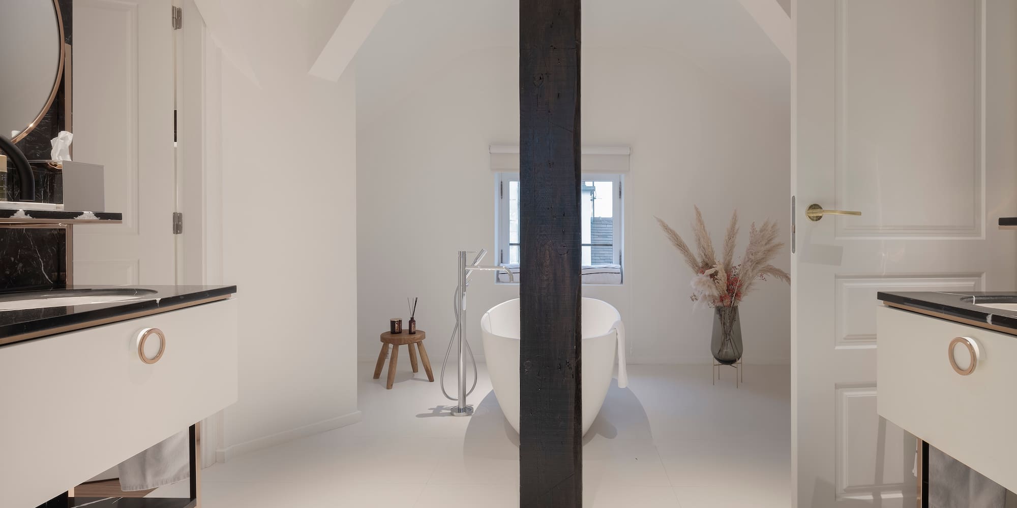 a bathroom with a tub and a sink