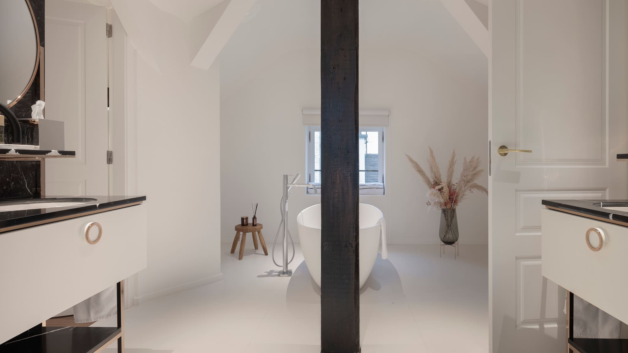 a bathroom with a tub and a sink