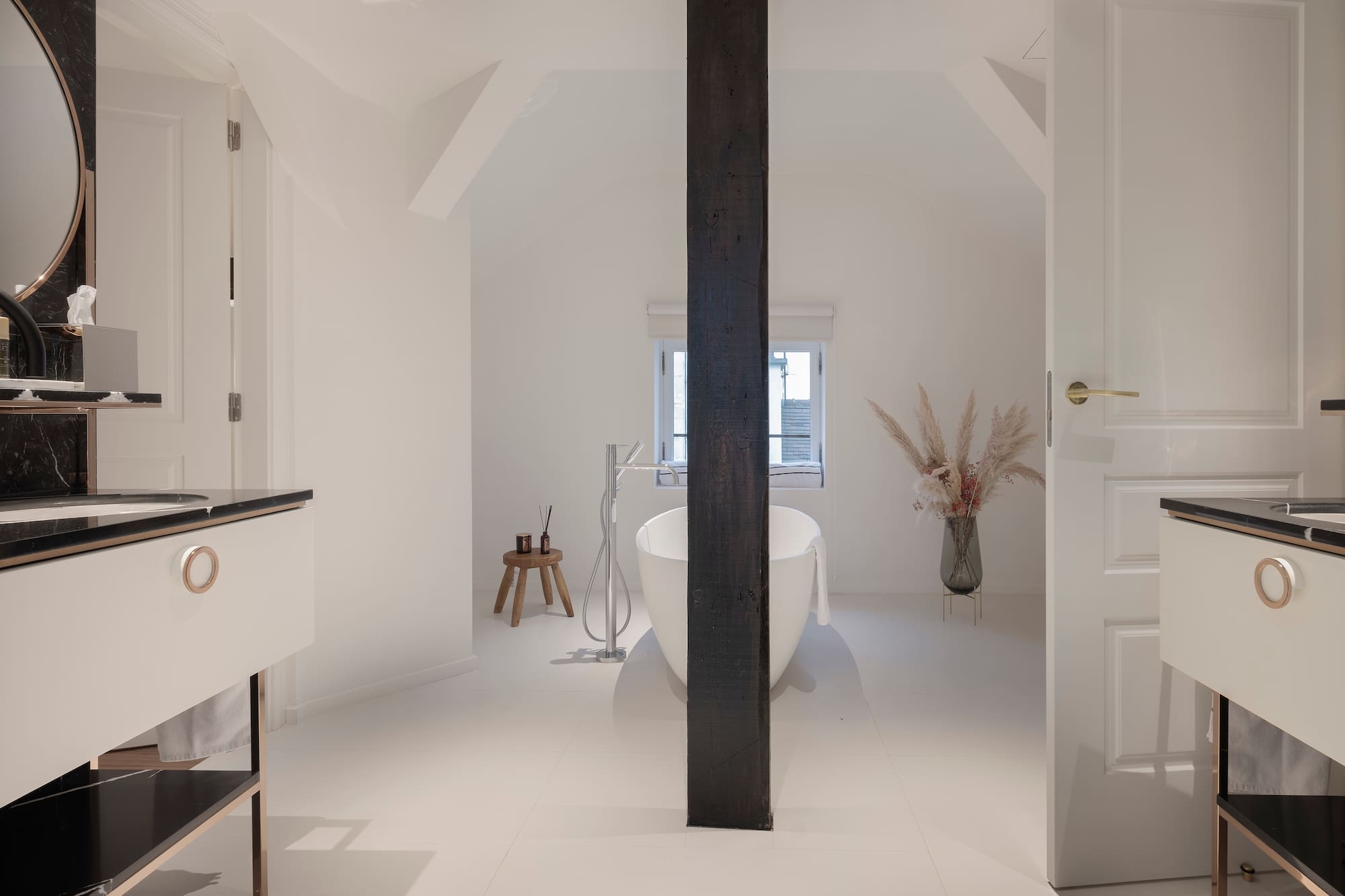 a bathroom with a tub and a sink