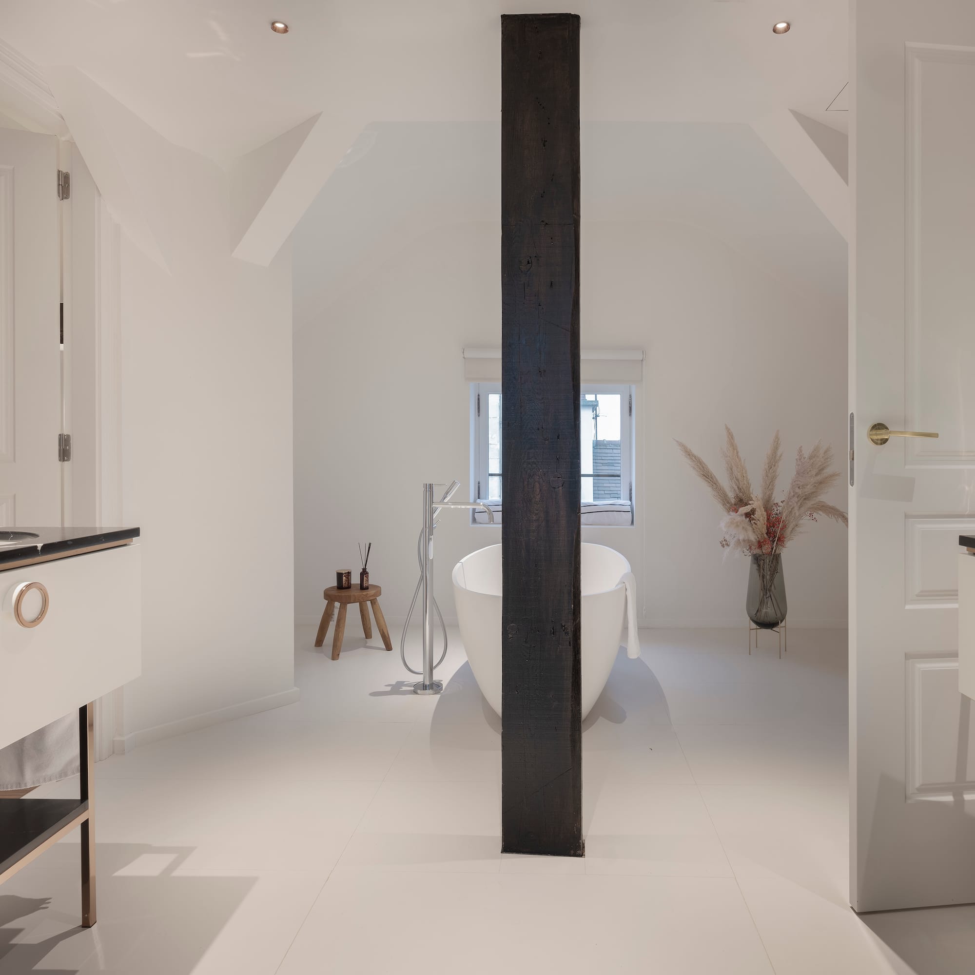 a bathroom with a tub and a sink