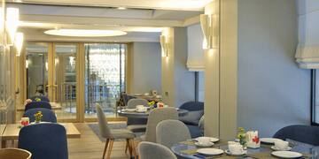 a room with tables and chairs