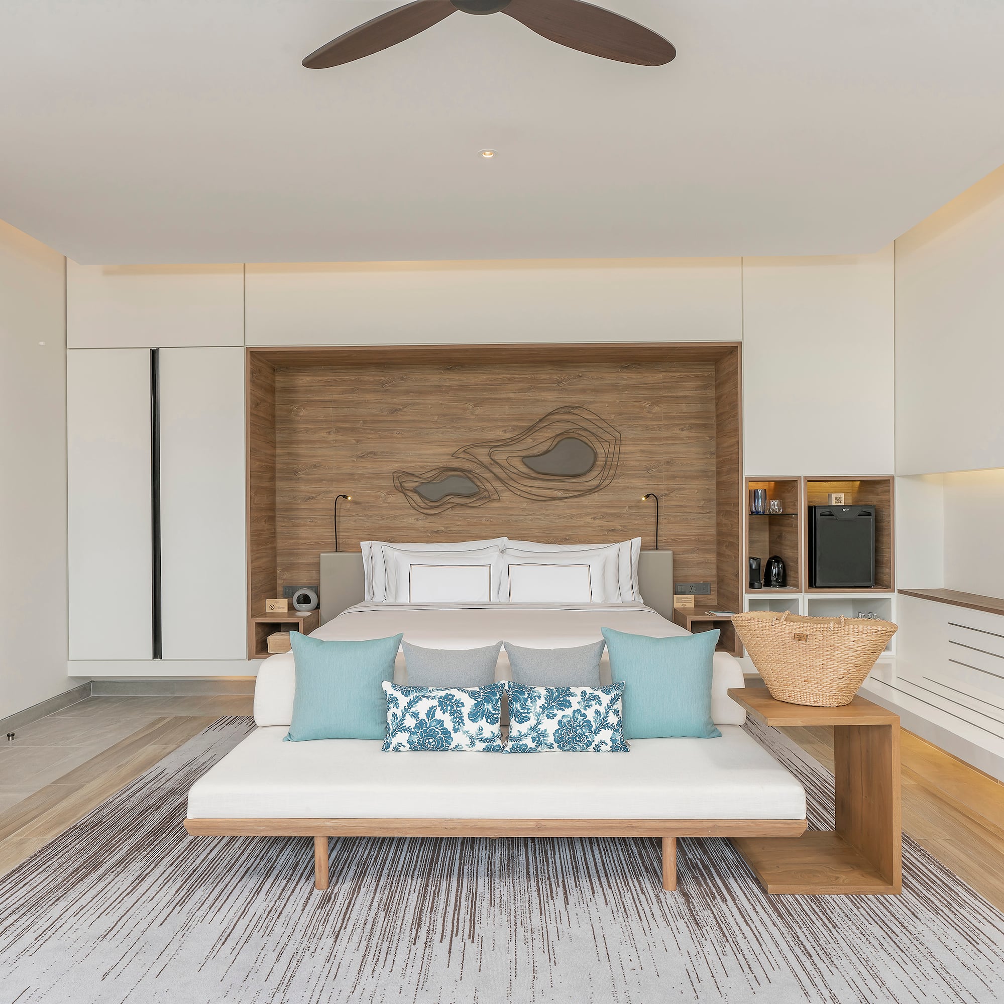 a room with a bed and a fan