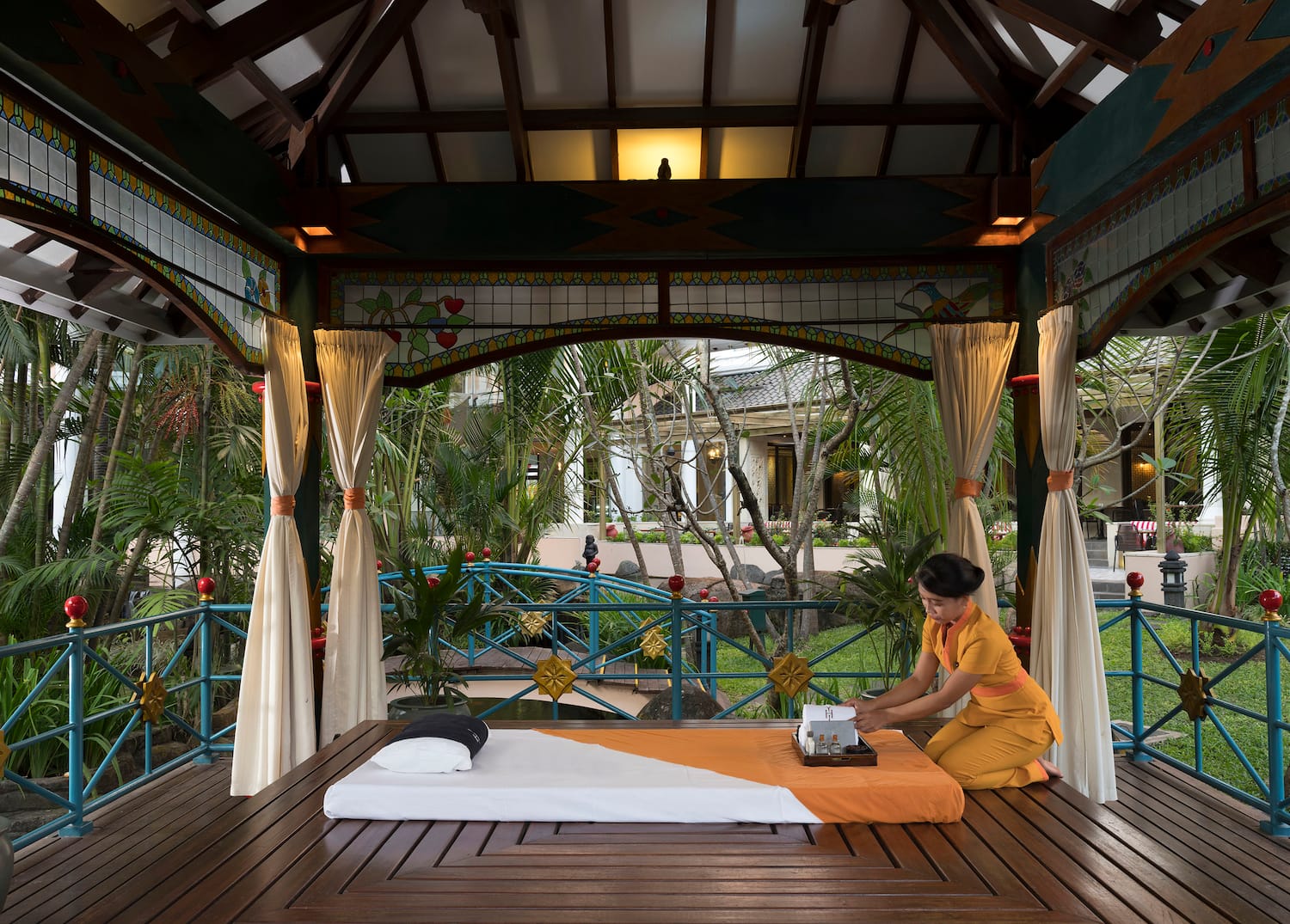 a woman sitting on a table with a typewriter