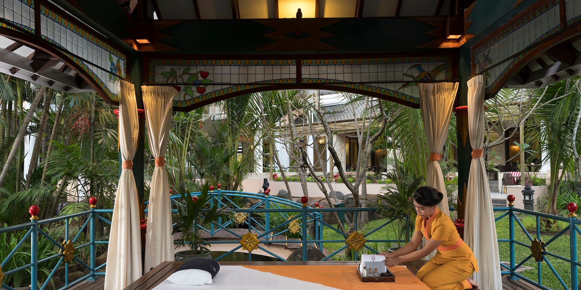 a woman sitting on a table with a typewriter
