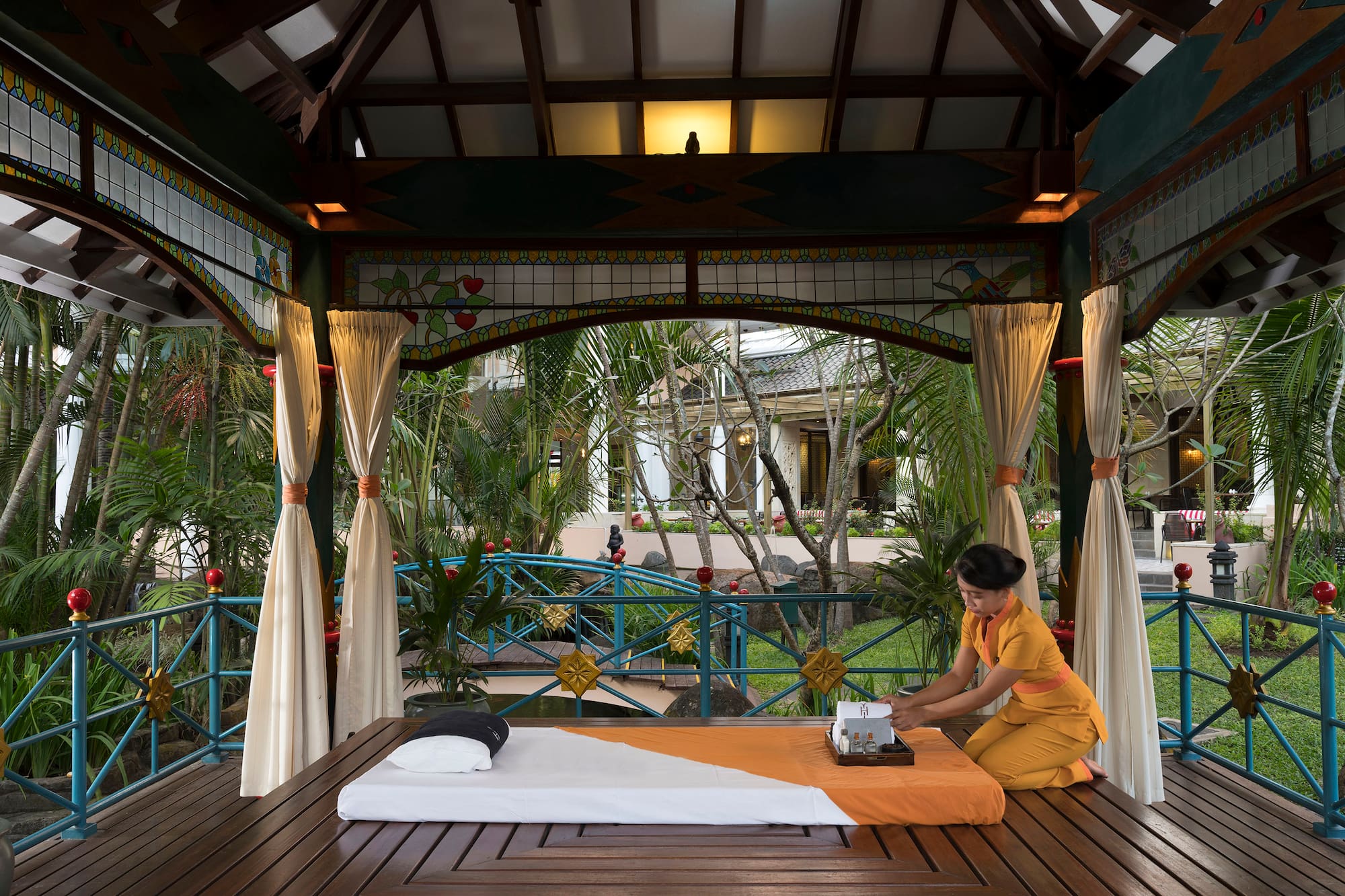 a woman sitting on a table with a typewriter