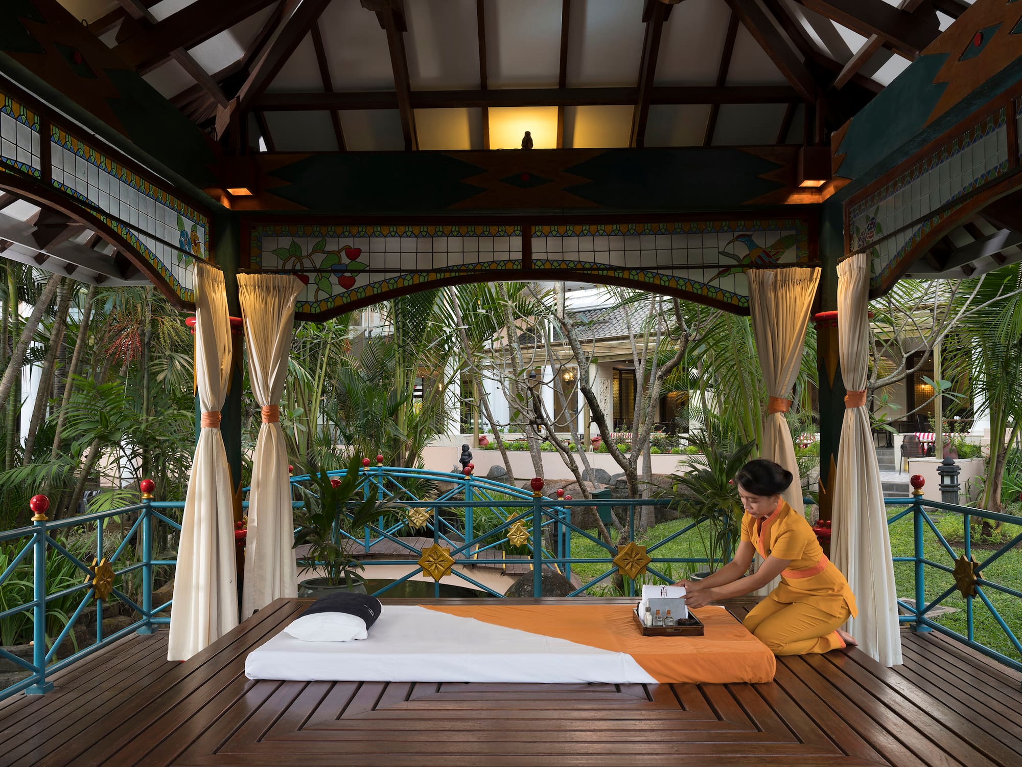 a woman sitting on a table with a typewriter