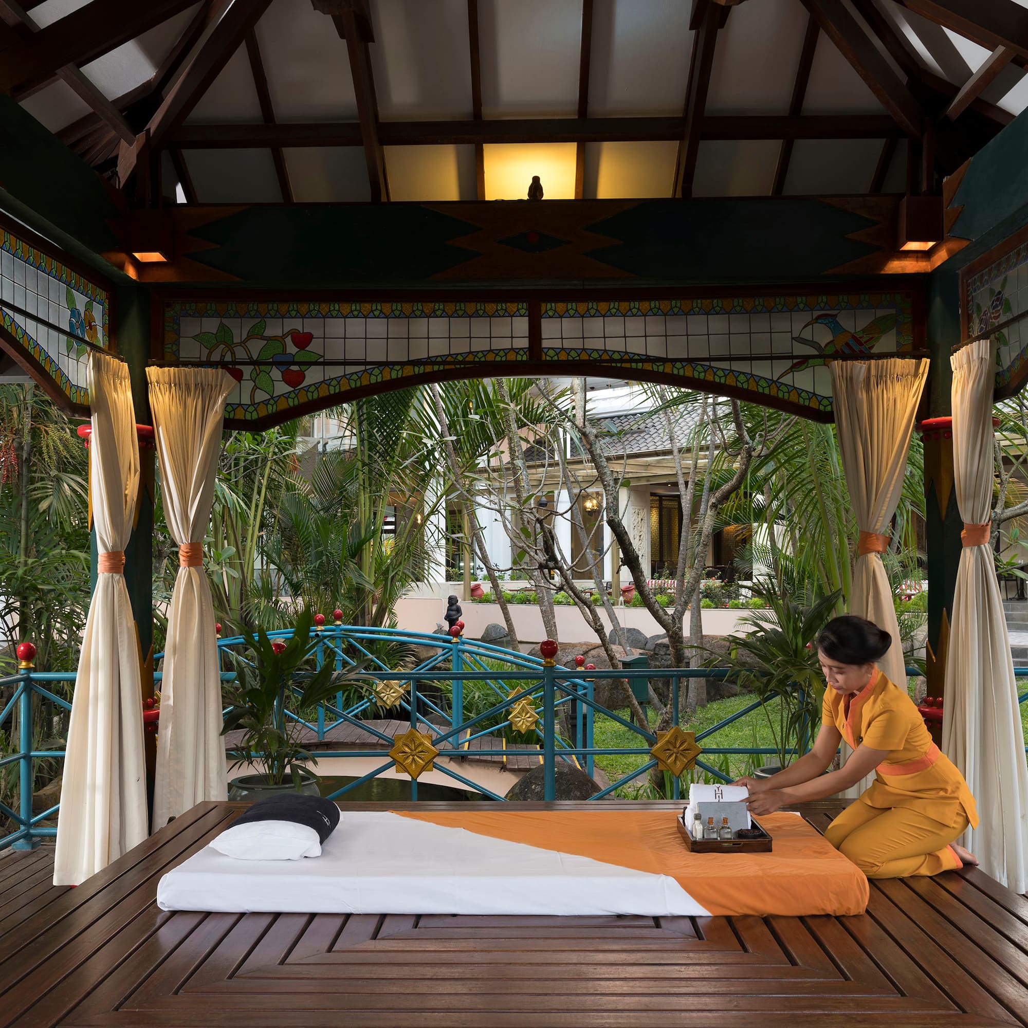 a woman sitting on a table with a typewriter