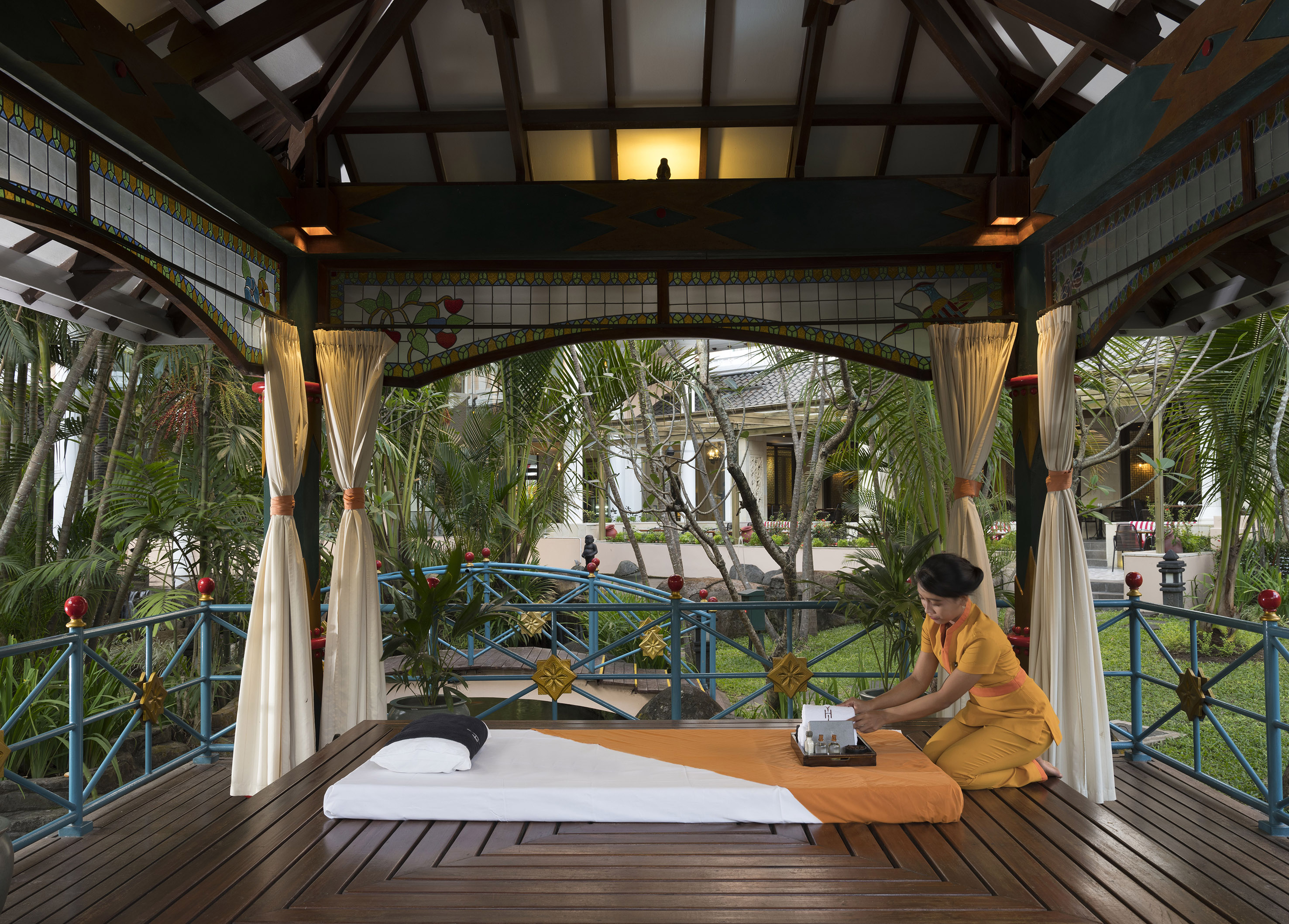 a woman sitting on a table with a typewriter