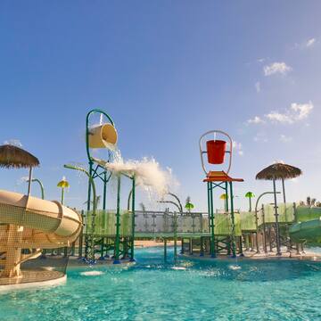 water park with a water slide and a pool