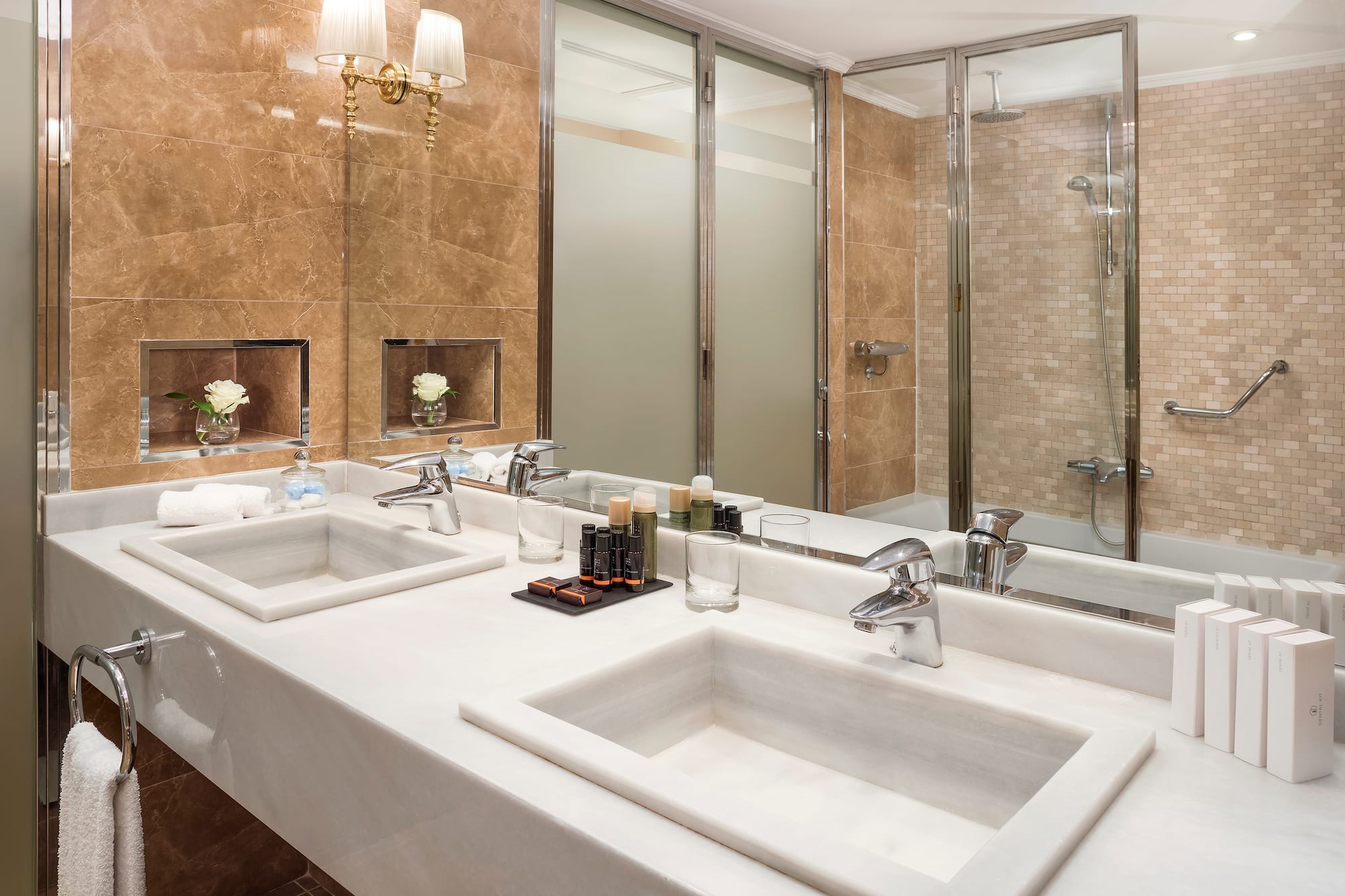 a bathroom with marble counter tops and sinks