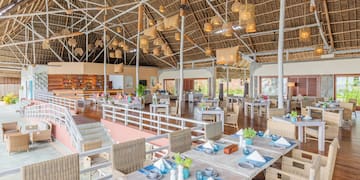 a large room with tables and chairs