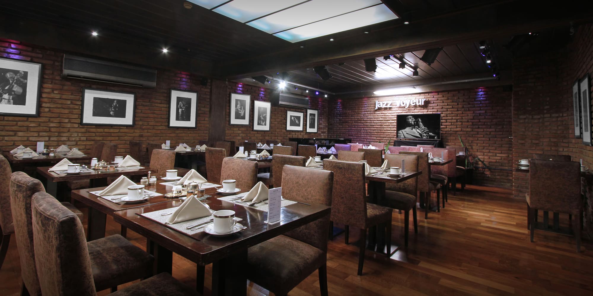 a restaurant with tables and chairs