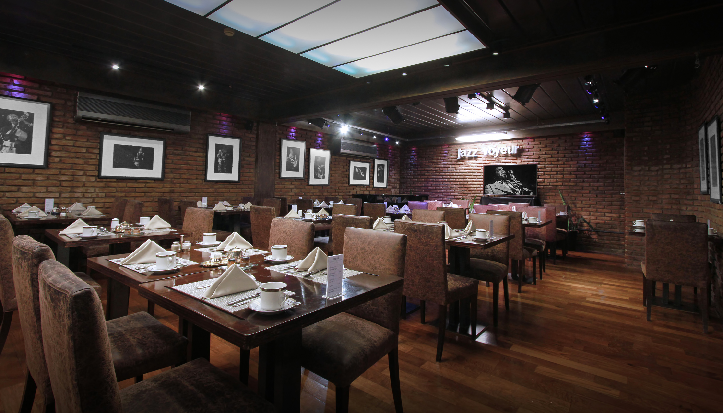 a restaurant with tables and chairs