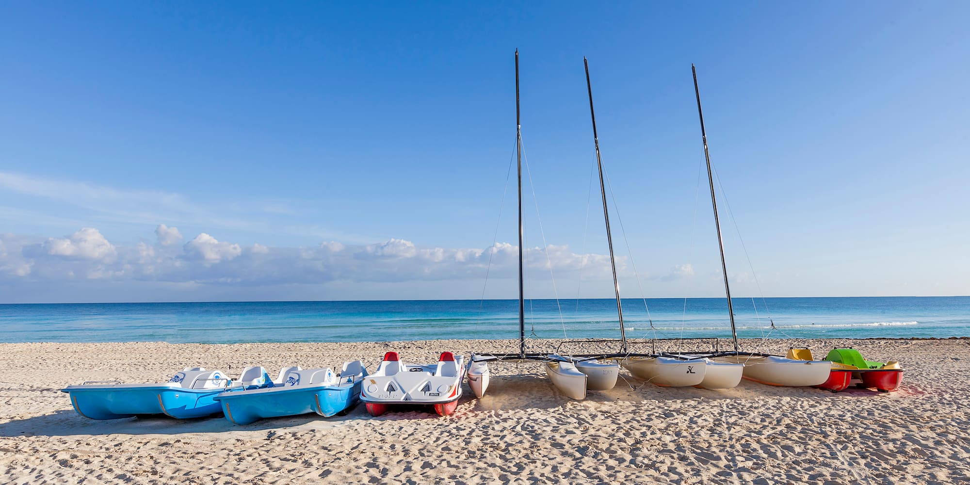 a group of boats on a beach