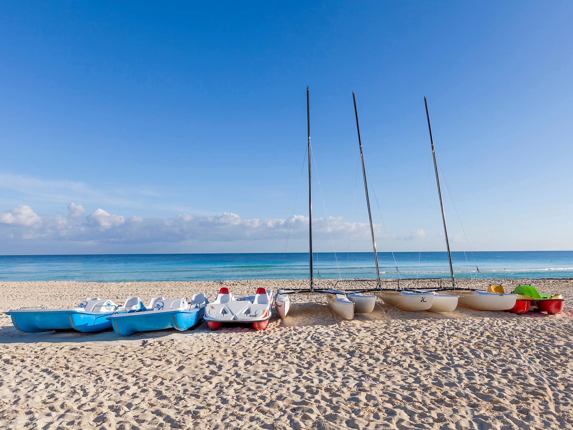 a group of boats on a beach