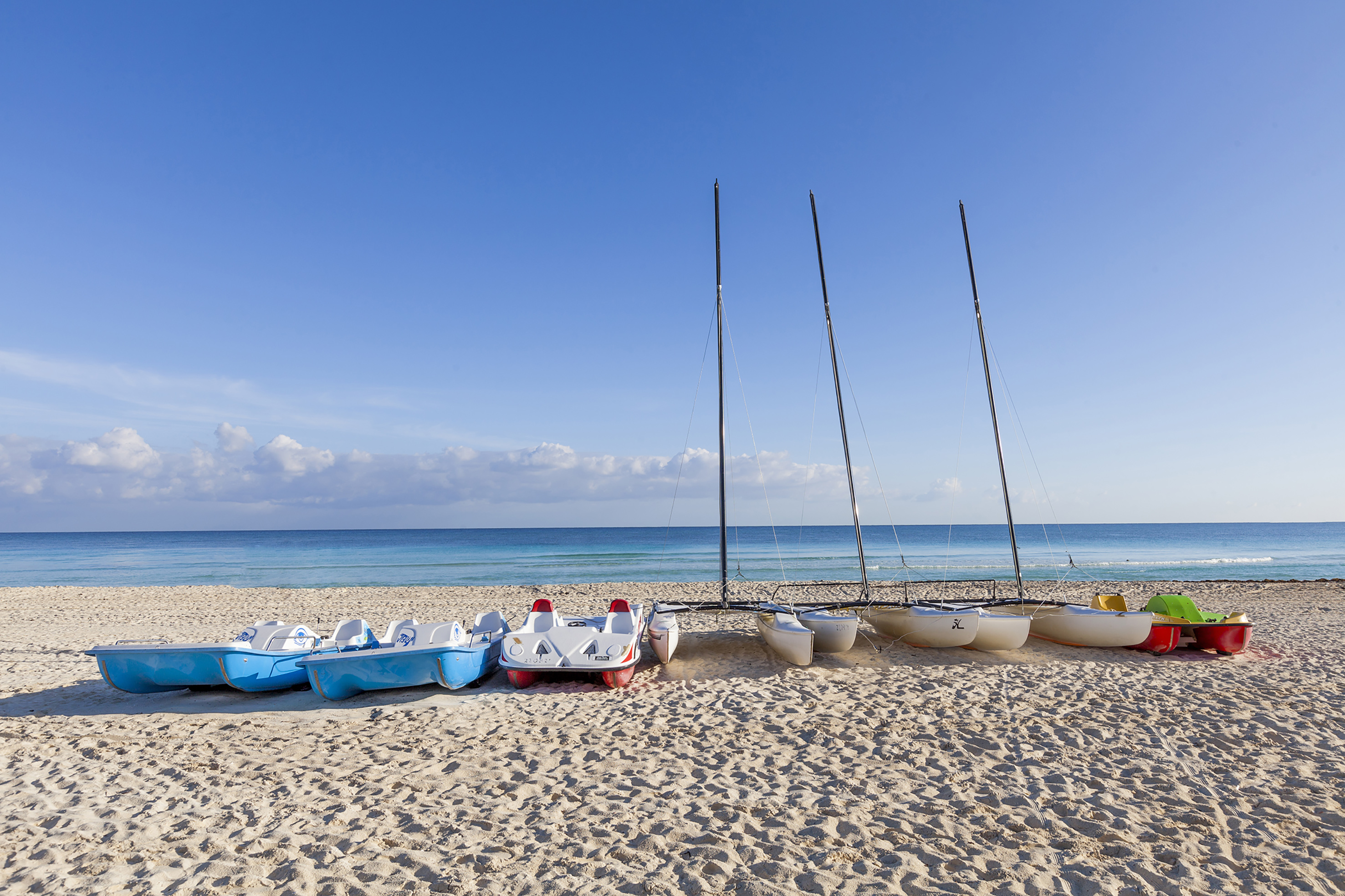 a group of boats on a beach