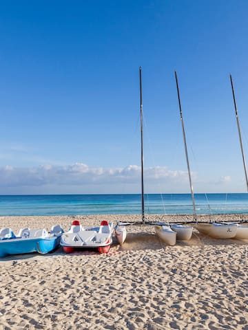 a group of boats on a beach
