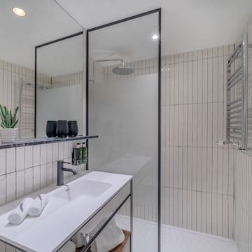 a bathroom with a shower and sink