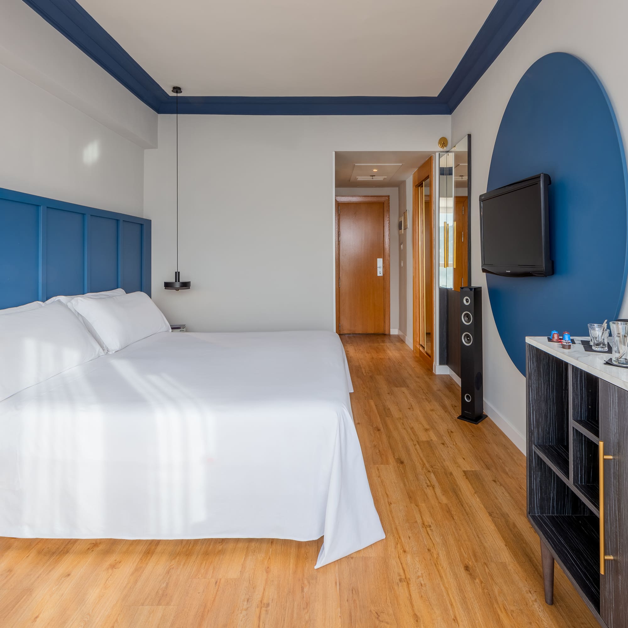 a room with a bed and a tv