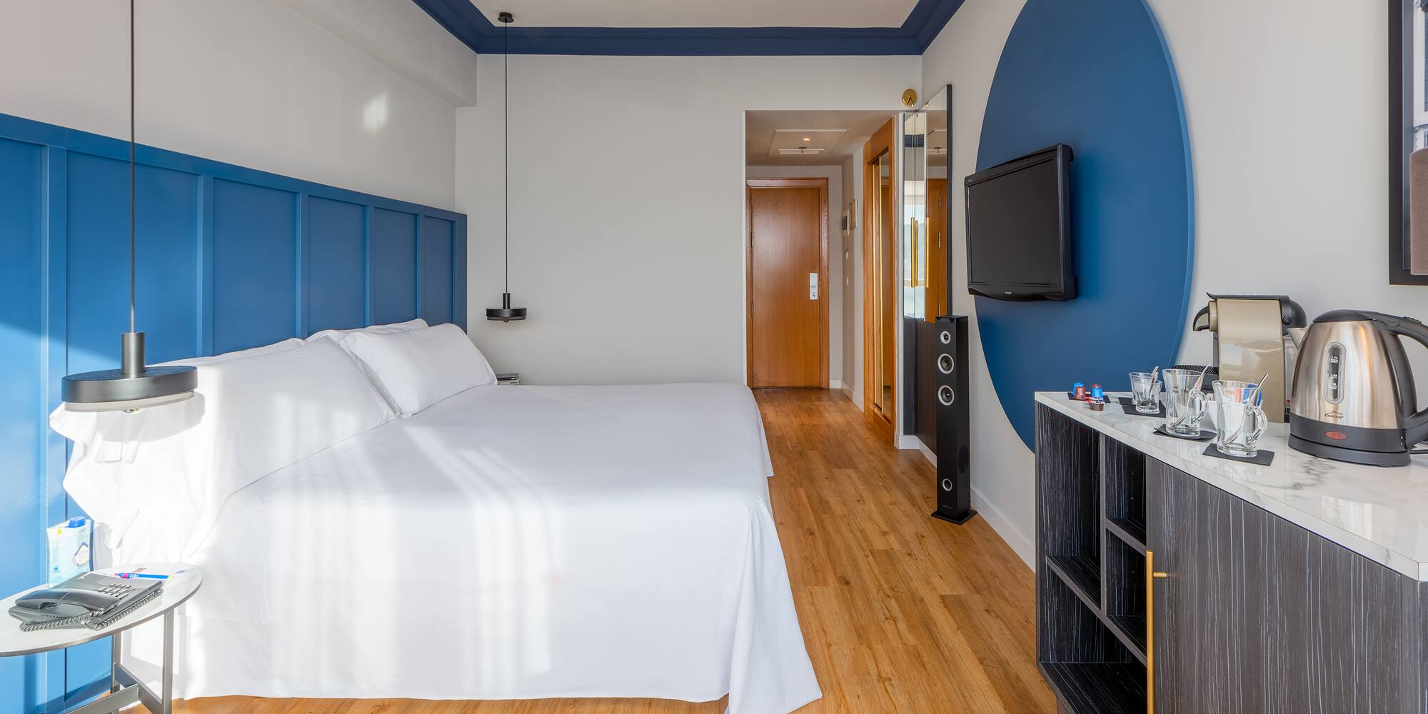 a room with a bed and a tv