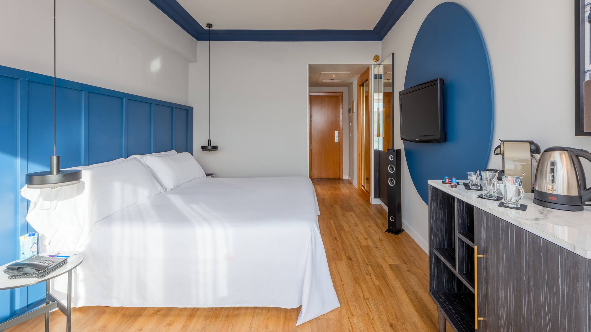 a room with a bed and a tv