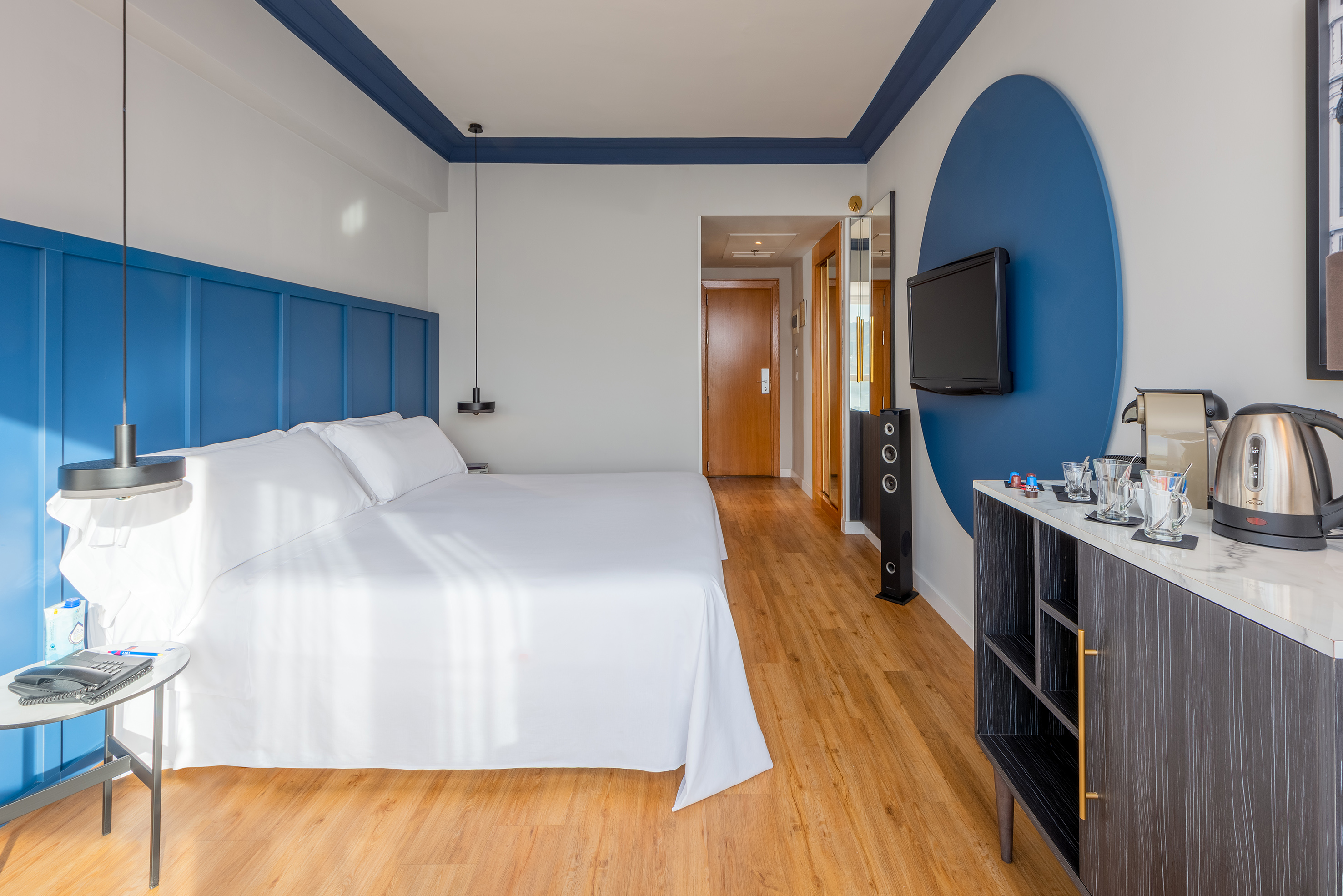 a room with a bed and a tv