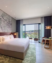 a bedroom with a bed and a table