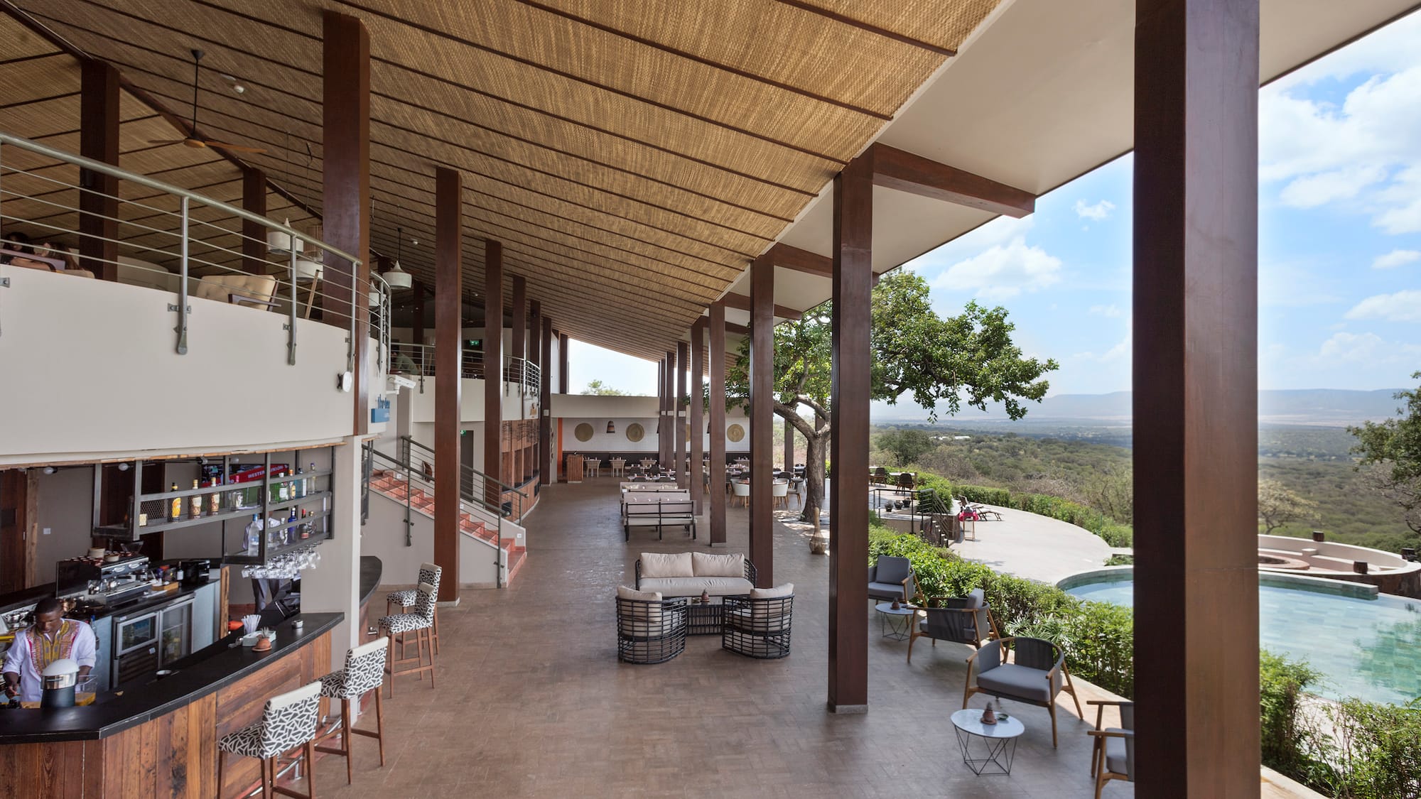 a patio with chairs and tables
