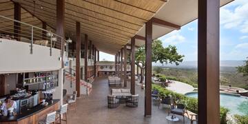 a patio with chairs and tables