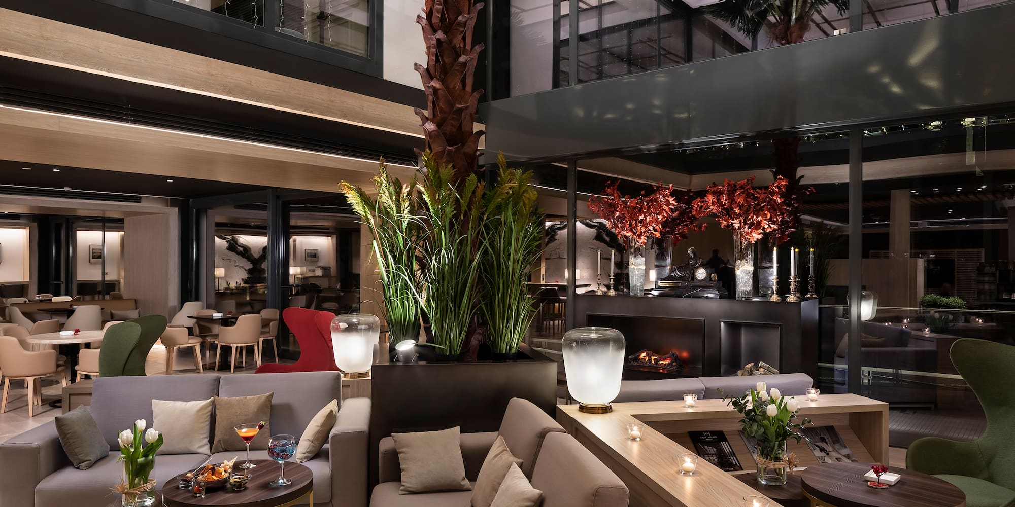 a room with a large tree and a couch