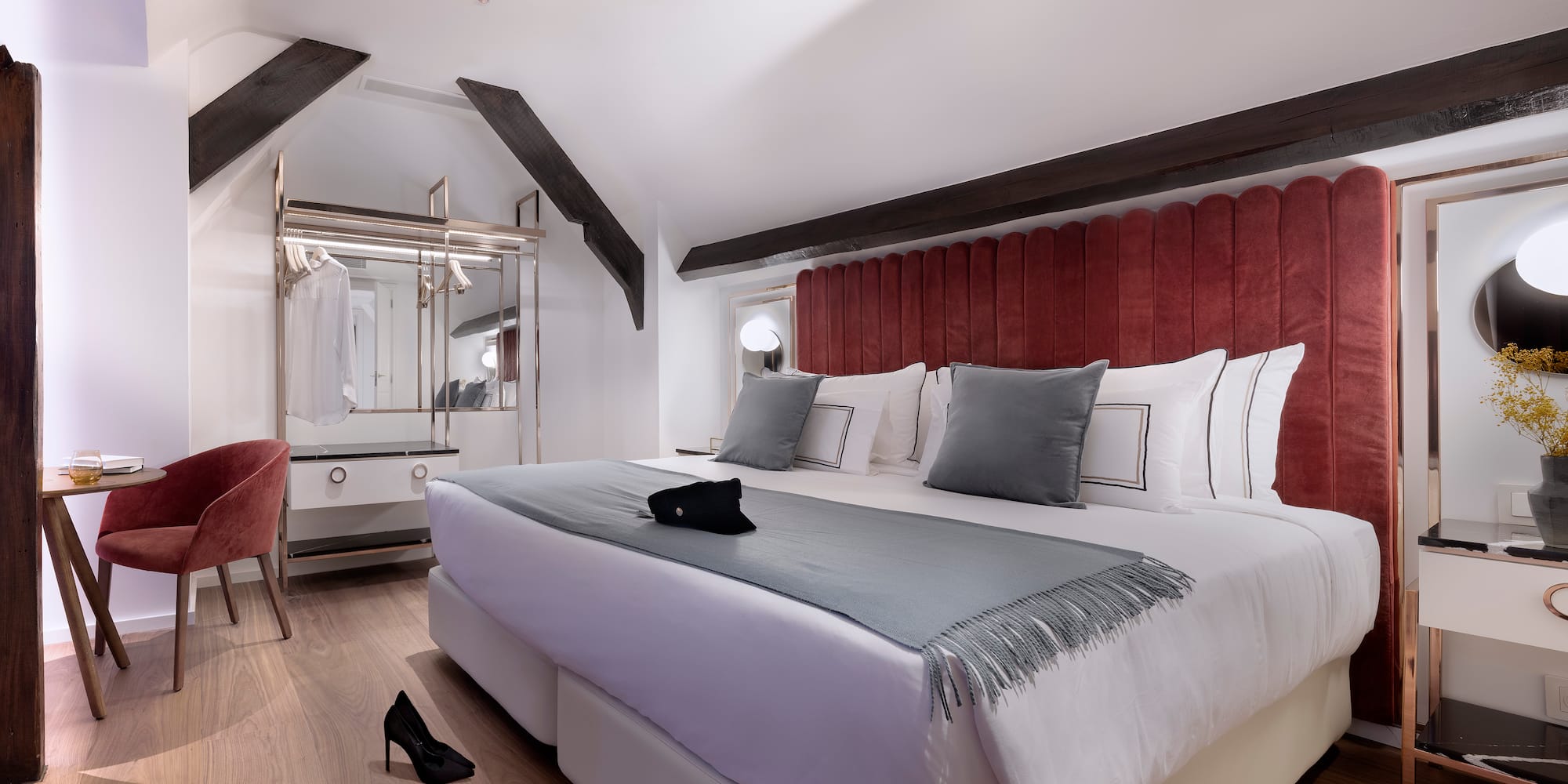 a bedroom with a bed and a mirror