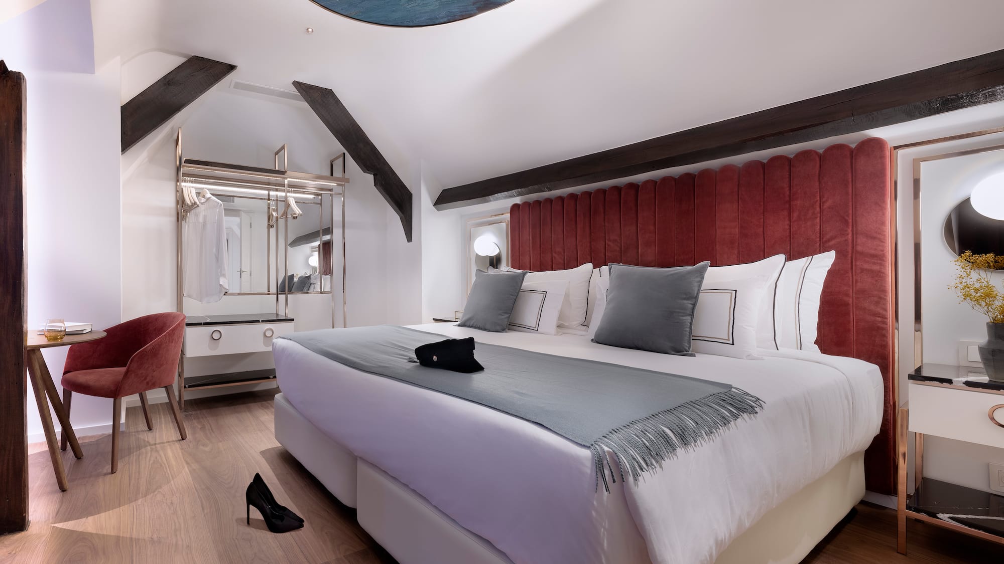 a bedroom with a bed and a mirror