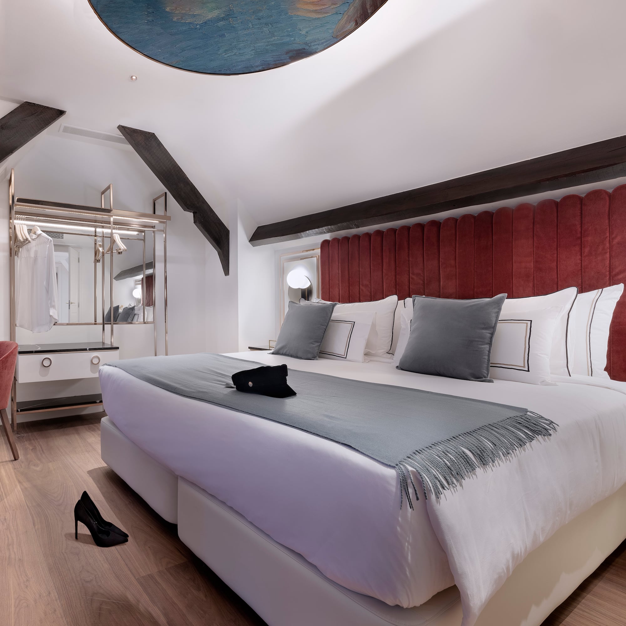 a bedroom with a bed and a mirror