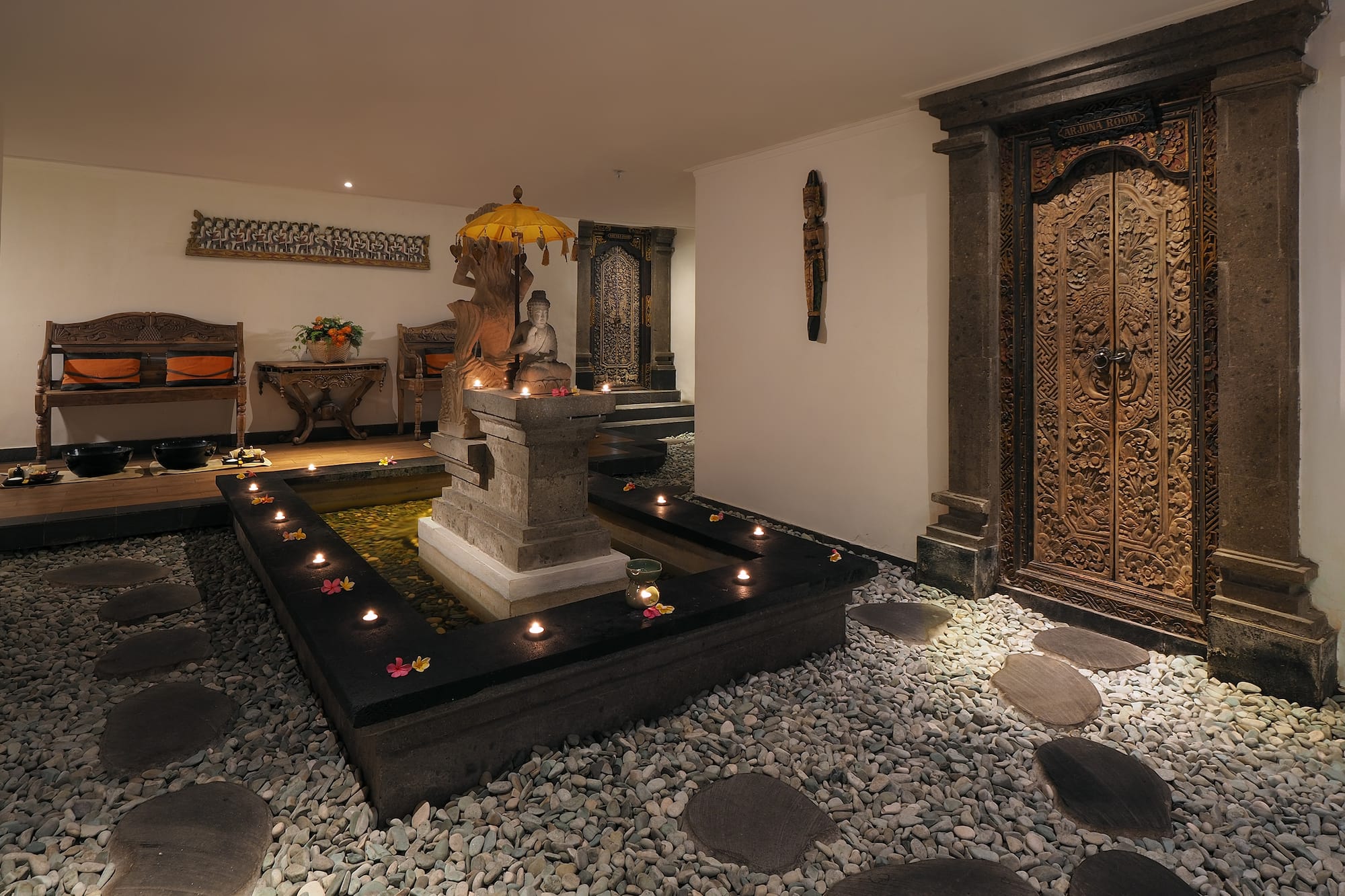 a room with a fountain and a door