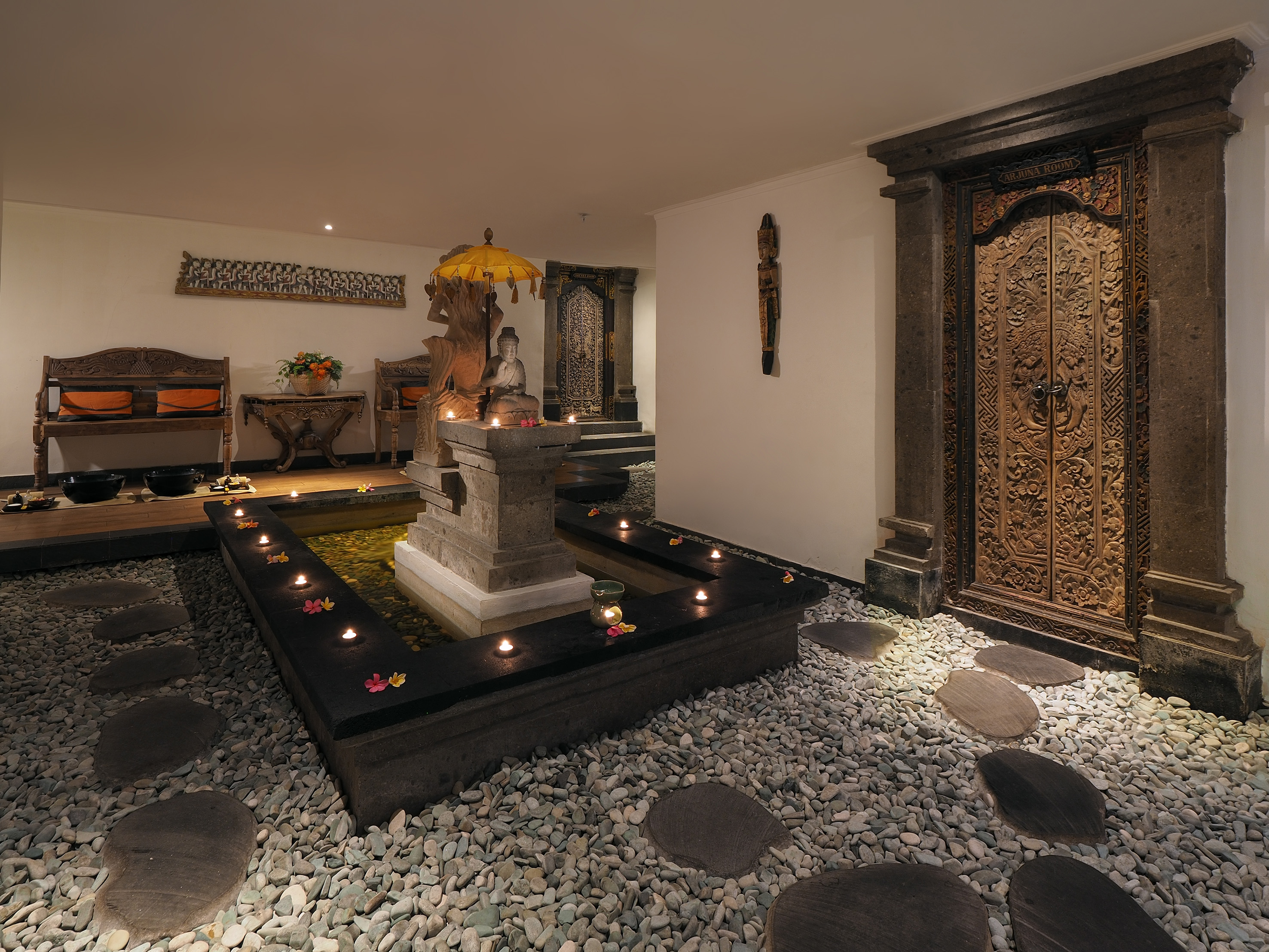 a room with a fountain and a door