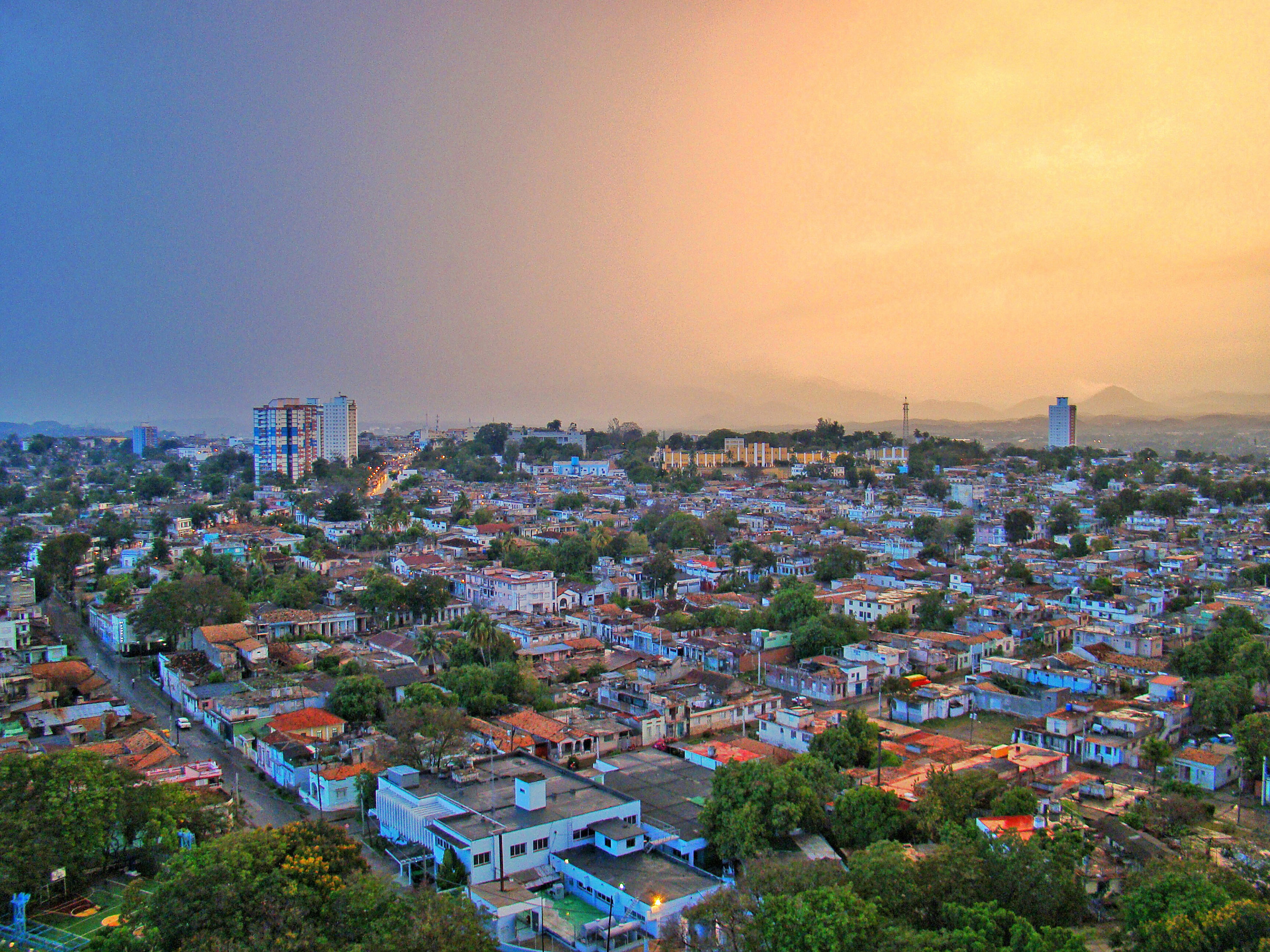 a city with many buildings and trees