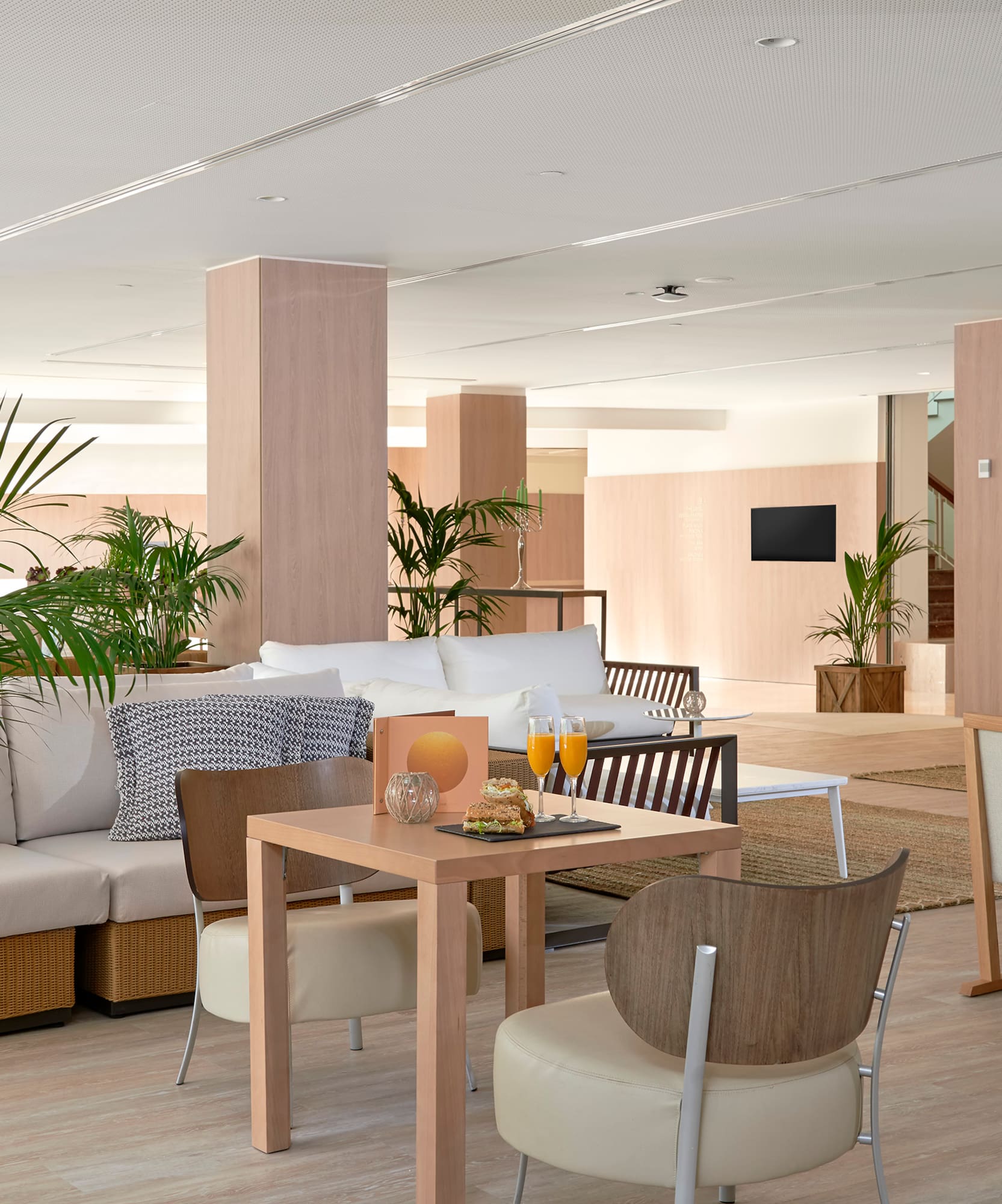 a room with a couch and chairs