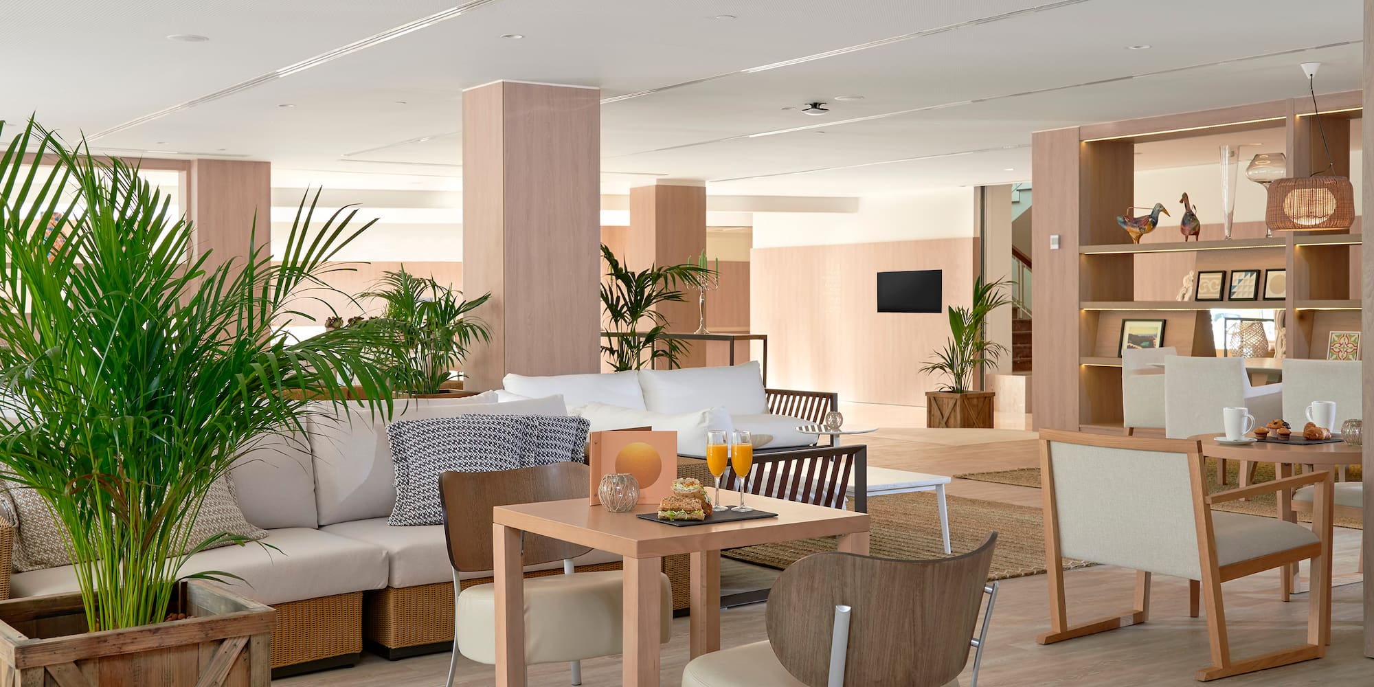 a room with a couch and chairs