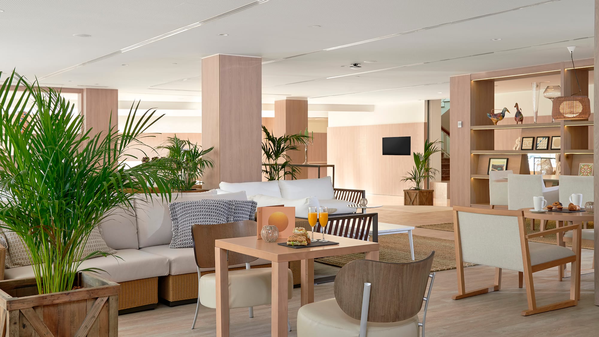 a room with a couch and chairs