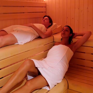 a couple of women in a sauna